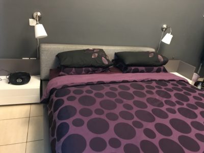 King size bed with two night tables and a mattress