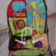 Infant car seat and baby bouncer with vibrator and toy hanger
