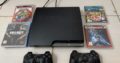PS3 with two controllers and CD’s